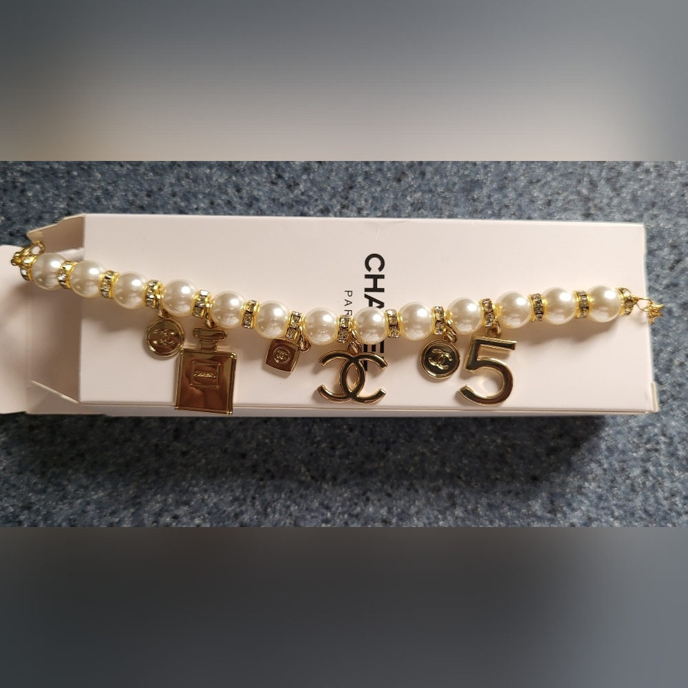 SOLD - Gold and White Charm Bracelet